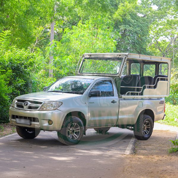 Mitsubishi L200 safari jeep, blue-grey, open-sided with roll bar canopy